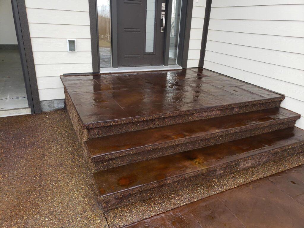 decorative red-brown stairs up to the front door