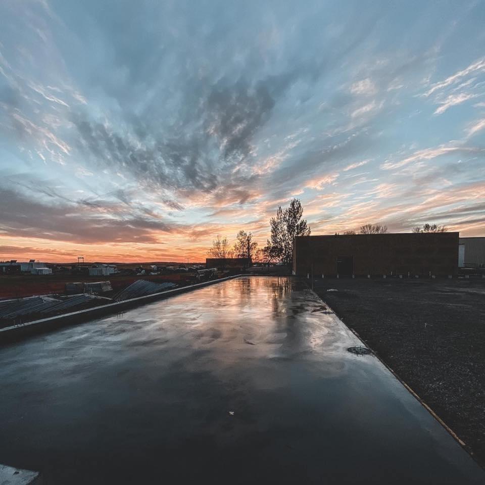sunset over a newly poured pad of concrete